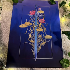May include: A blue sword with a gold hilt is surrounded by gold vines and pink water lilies on a dark blue background.