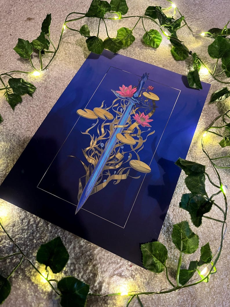 May include: A blue and gold sword with a floral design. The sword is surrounded by water lilies and leaves. The background is a dark blue gradient.