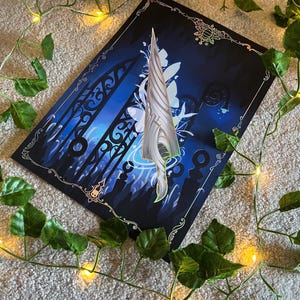 May include: A black and blue poster featuring a silver sword and a gate in the background. The sword is surrounded by white flowers and vines. The poster has a gold border and a gold design in the top right corner.