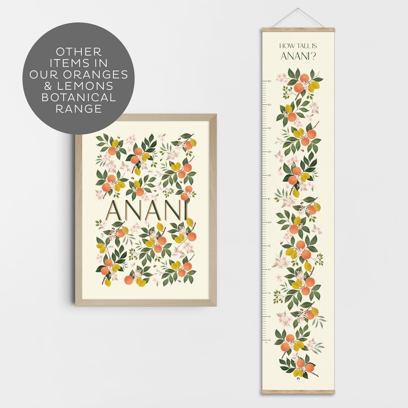 May include: A white and cream growth chart with a floral design featuring orange blossoms, lemons, and leaves. The chart is labeled "How Tall is Anani?" and includes a measurement scale in inches. The chart is framed with a natural wood frame.