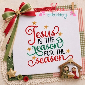 May include: A white square with the embroidered text "Jesus is the reason for the season" in red and green. The design includes gold stars and a nativity scene. A red, green, and cream ribbon bow adorns the top left corner.