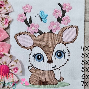 May include: Embroidered design of a cute fawn with pink flowers on its antlers and a blue butterfly. The design is available in various sizes, including 4x4, 5x4, 5x7, 5x8, 6x10, and 7x12 inches.