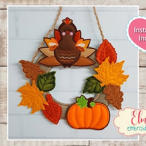 May include: Embroidered Thanksgiving wreath with a brown turkey, orange pumpkin, and fall leaves in shades of orange, yellow, and green.  The wreath is designed for an in-the-hoop embroidery project and is available in 5x7, 6x10, and 7x12 hoop sizes. Instructions are included.