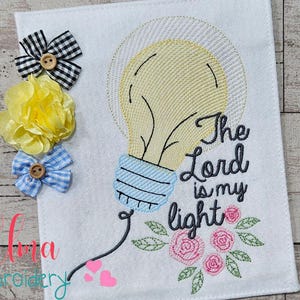 May include: Embroidered design featuring a light bulb with the text "The Lord is my light" and floral accents. Available in sizes 4x4, 5x4, 5x7, 5x8, 6x10, and 7x12 inches.