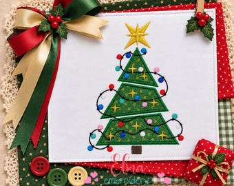May include: A white fabric square featuring an embroidered green Christmas tree with a yellow star, colorful lights, and small stars. It is decorated with a large red, green, and gold ribbon bow, a small red gift box, and three round buttons.