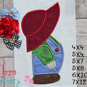 May include: Embroidered design of a boy wearing a red cap, green shirt, and blue overalls with white polka dots. The design includes a brown shoe and is on a white background. Three decorative bows are on the left side.