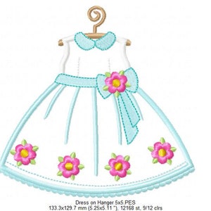 May include: A light blue dress with a white collar and a blue bow with a pink flower. The dress is on a hanger and has five pink flowers on the skirt. The dress is 5.25 inches by 5.11 inches and has 12,168 stitches and 9/12 colors.