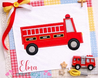 May include: A red embroidered fire truck with a ladder, black wheels, and a white window is displayed on a white background. The design includes the text "Elma embroidery". A small toy fire truck and decorative elements are also present.