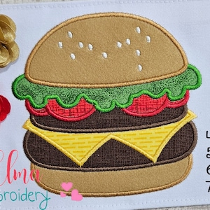 May include: Embroidered design of a double-decker hamburger with cheese, lettuce, and tomato. The design is available in four sizes: 4x4, 5x5, 6x6, and 7x7 inches.