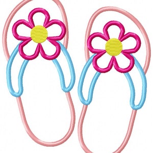 May include: A pair of pink flip flops with blue straps and a pink flower with a yellow center on each strap.