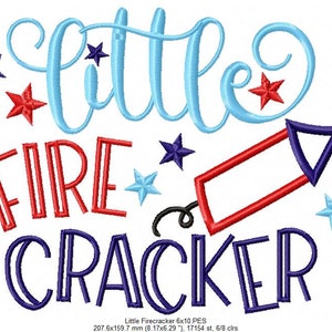May include: An embroidery design featuring the text "little FIRE CRACKER" in light blue, red, and dark blue. The design includes a red and dark blue firecracker icon and several stars in red, dark blue, and light blue. A color chart is on the left.