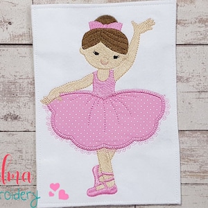May include: Embroidered design of a ballerina with brown hair, wearing a pink tutu with white polka dots and pink ballet shoes.