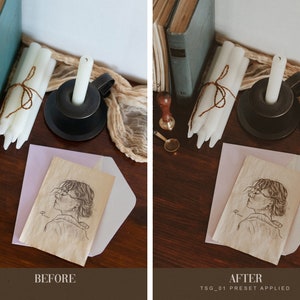May include: A drawing of a person with glasses on a piece of paper with a light pink envelope on top of it. The paper is on a wooden table with white candles, a black candle holder, and a brown rope.