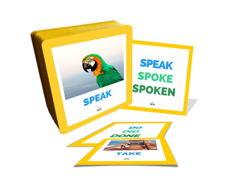 Puede incluir: Un mont&oacute;n de tarjetas did&aacute;cticas con bordes amarillos con im&aacute;genes y palabras. Una tarjeta muestra un loro y la palabra "SPEAK". Otras tarjetas muestran conjugaciones verbales: "SPEAK SPOKE SPOKEN", "DO DID DONE" y "TAKE".