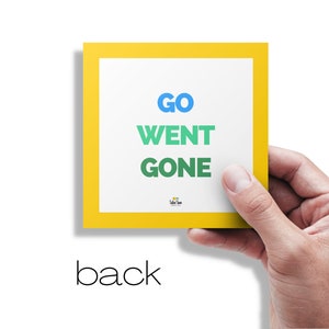 May include: A yellow card with a white border and the words "GO", "WENT", and "GONE" in different colors.