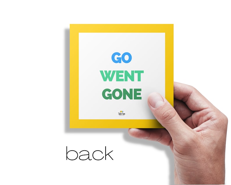 May include: A yellow card with a white border and the words "GO", "WENT", and "GONE" in different colors.