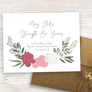 May include: A white card with a floral design and the text "May God's Strength Be Yours" and "God is able to make all grace abound toward you. 2 Corinthians 9:8".