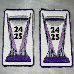 May include: Two embroidered patches with a purple and silver trophy design. Each patch has the numbers "24" and "25" in black. The patches are rectangular with a white border.