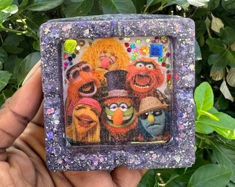 Púrpura brillante, cenicero de pedrería.