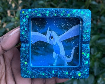 Cenicero de resina azul brillante y azul cielo.