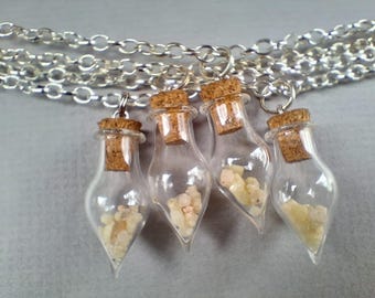 Rare and Powerful Rhodozite Crystals in a glass drop pendant on chain.