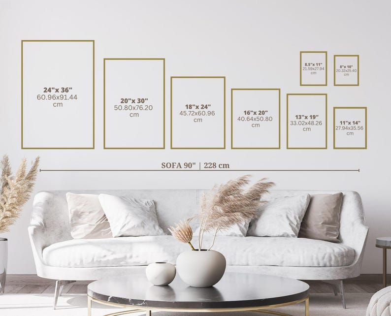 May include: A display of framed art prints in various sizes, including 24" x 36", 20" x 30", and 18" x 24", arranged above a sofa. The image includes measurements in inches and centimeters, showcasing a range of wall art options.