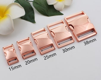 May include: Five rose gold metal buckle clasps in different sizes, measuring 15mm, 20mm, 25mm, 30mm, and 38mm.