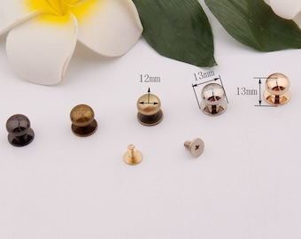 May include: Assortment of five metal dome-shaped buttons with screw backs in various finishes, including gold, silver, and bronze. The buttons are 12mm and 13mm in diameter.