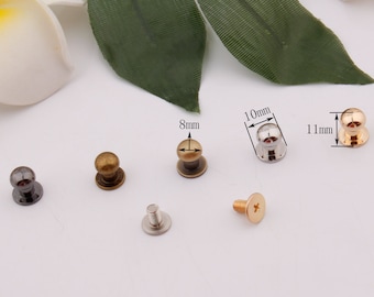 May include: Assortment of six metal knobs with different finishes, including black, gold, and silver. The knobs are 8mm, 10mm, and 11mm in diameter.