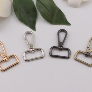 May include: Four metal swivel clasps in gold, silver, black, and bronze.