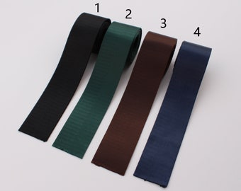 May include: Four different colors of ribbon, labeled 1 through 4. The ribbon is black, green, brown, and blue.