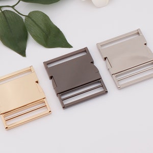 May include: Three metal buckle closures in gold, silver, and gunmetal.