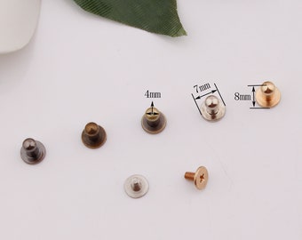 May include: Assortment of six metal dome-shaped studs in various sizes, including 4mm, 7mm, and 8mm. The studs are in gold, silver, and bronze tones. A screw is also included.