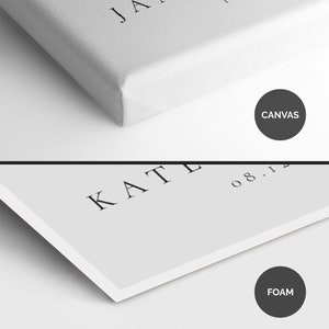 May include: Close-up of a white canvas print with the text "KATE 08.12" printed in black. The print is mounted on a white foam board.