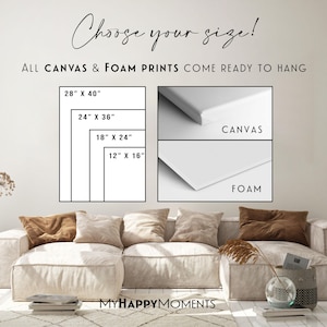 a living room with a couch and a wall decal