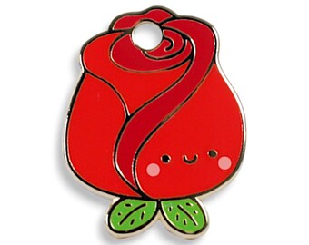 May include: A red rose with a smiling face and green leaves. The rose is a metal pin with a gold finish.
