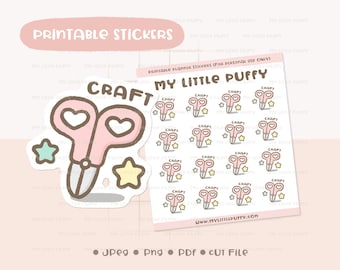 May include: Printable planner stickers featuring a pink pair of scissors with hearts and stars. The stickers say "CRAFT" and "MY LITTLE PUFFY".