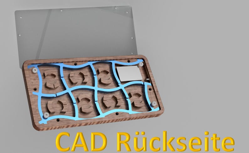 May include: A wooden box with a blue grid design and a clear lid. The box has a rectangular shape with curved cutouts. The text "CAD R&uuml;ckseite" is displayed in yellow at the bottom of the image.