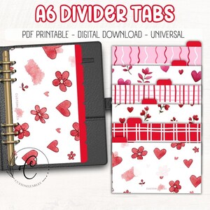 May include: A6 divider tabs with red tabs and various designs. The designs include hearts, flowers, and watercolor splashes. The text "A6 DIVIDER TABS" is at the top. The text "PDF PRINTABLE - DIGITAL DOWNLOAD - UNIVERSAL" is below the title.