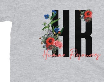 May include: A grey t-shirt with a black "HR" graphic surrounded by colorful flowers. The text "Human Resources" is written in pink below the graphic.
