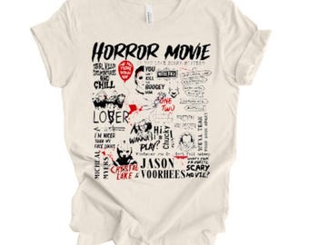 May include: Off-white t-shirt with the words "HORROR MOVIE" in black, along with horror film references. The design includes character names and quotes in black and red. A relaxed-fit tee, perfect for casual wear.
