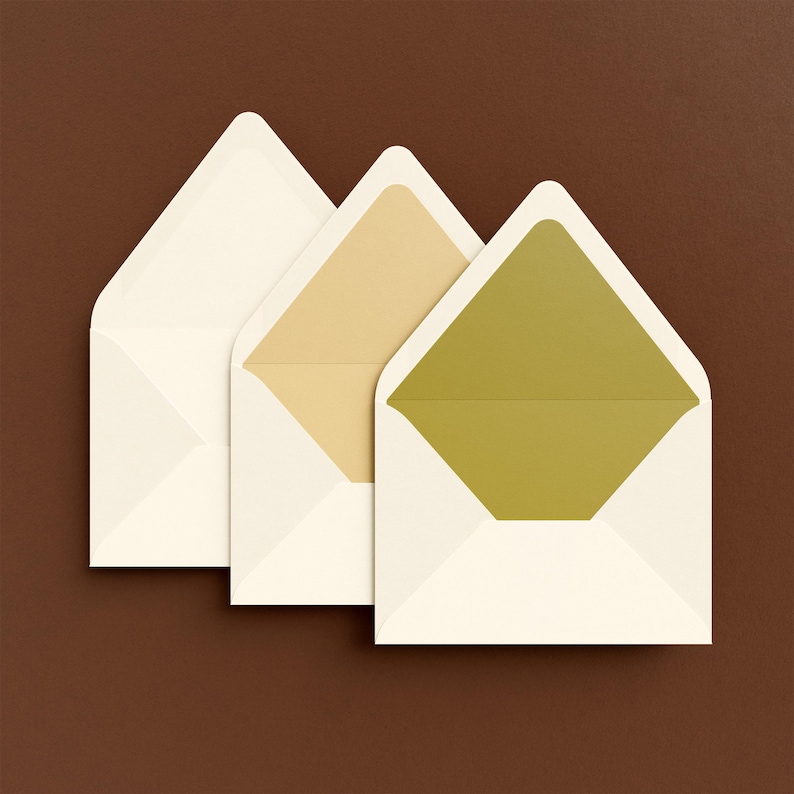 May include: Three white envelopes with different coloured inner flaps. The leftmost envelope has a white inner flap, the middle envelope has a beige inner flap, and the rightmost envelope has a green inner flap.