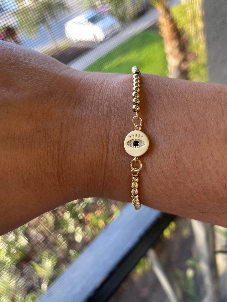Adjustable golden bracelet with Turkish eye charm!