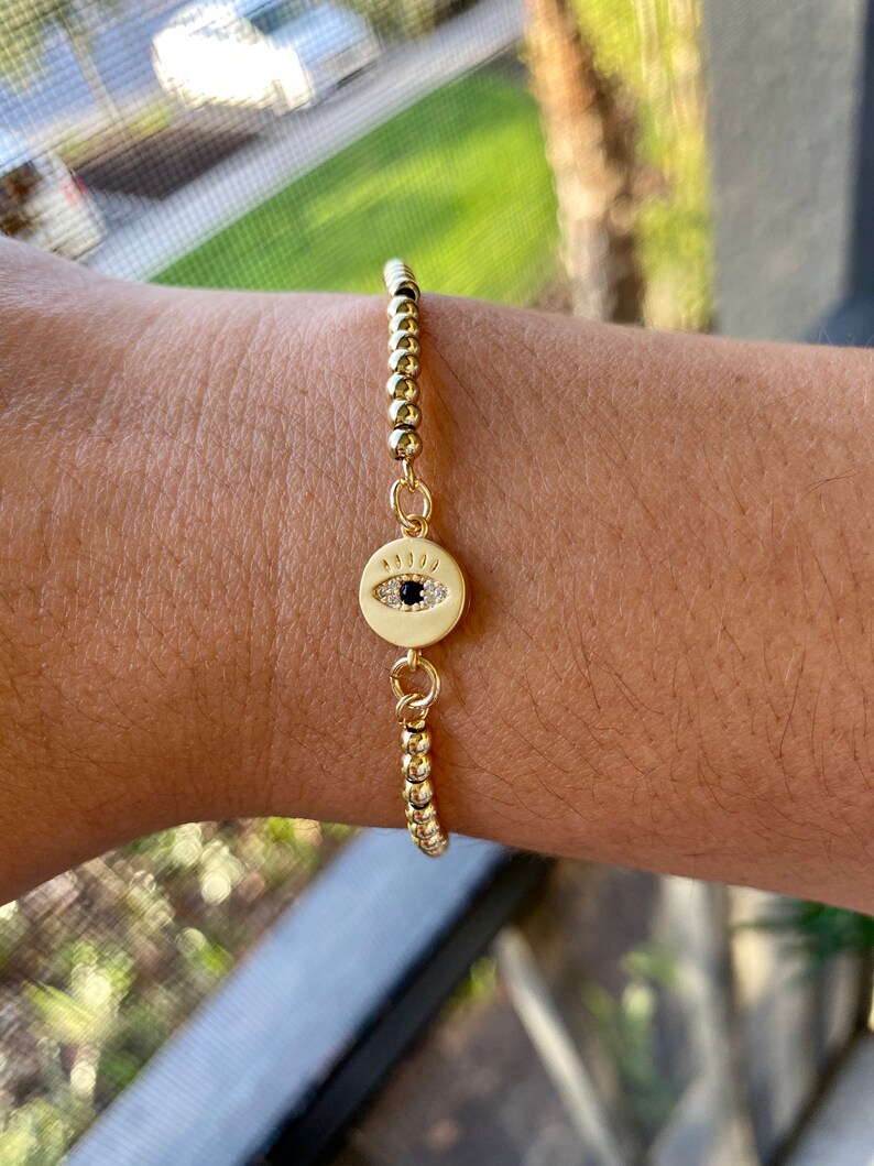 Adjustable golden bracelet with Turkish eye charm!