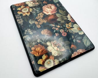 May include: A black case with a floral design. The flowers are in shades of pink, orange, yellow, and green on a dark background.