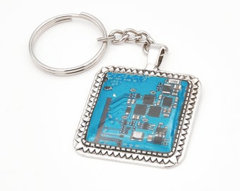 Blue printed circuit board keychain, square frame metal alloy, protected with Epoxy resin - Bisuttronics.