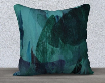 May include: A teal and green cushion with an abstract watercolour design. The cushion is made of soft fabric and has a square shape.