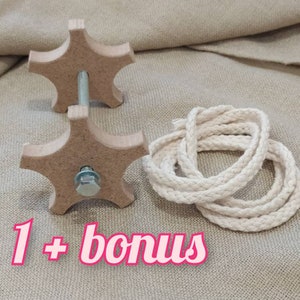 May include: A wooden star-shaped perch with a metal rod and a nut, and a white cotton rope. The text "1 + bonus" is written below the perch.