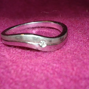Pure silver double ring with a diamond set across the ring