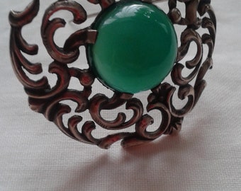 Translucent deep green chrysoprase and decorative silver brooch